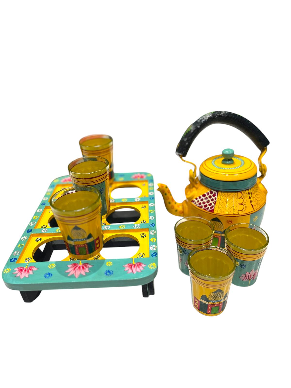Handpainted indian tea kettle with 6 glasses and a kart.