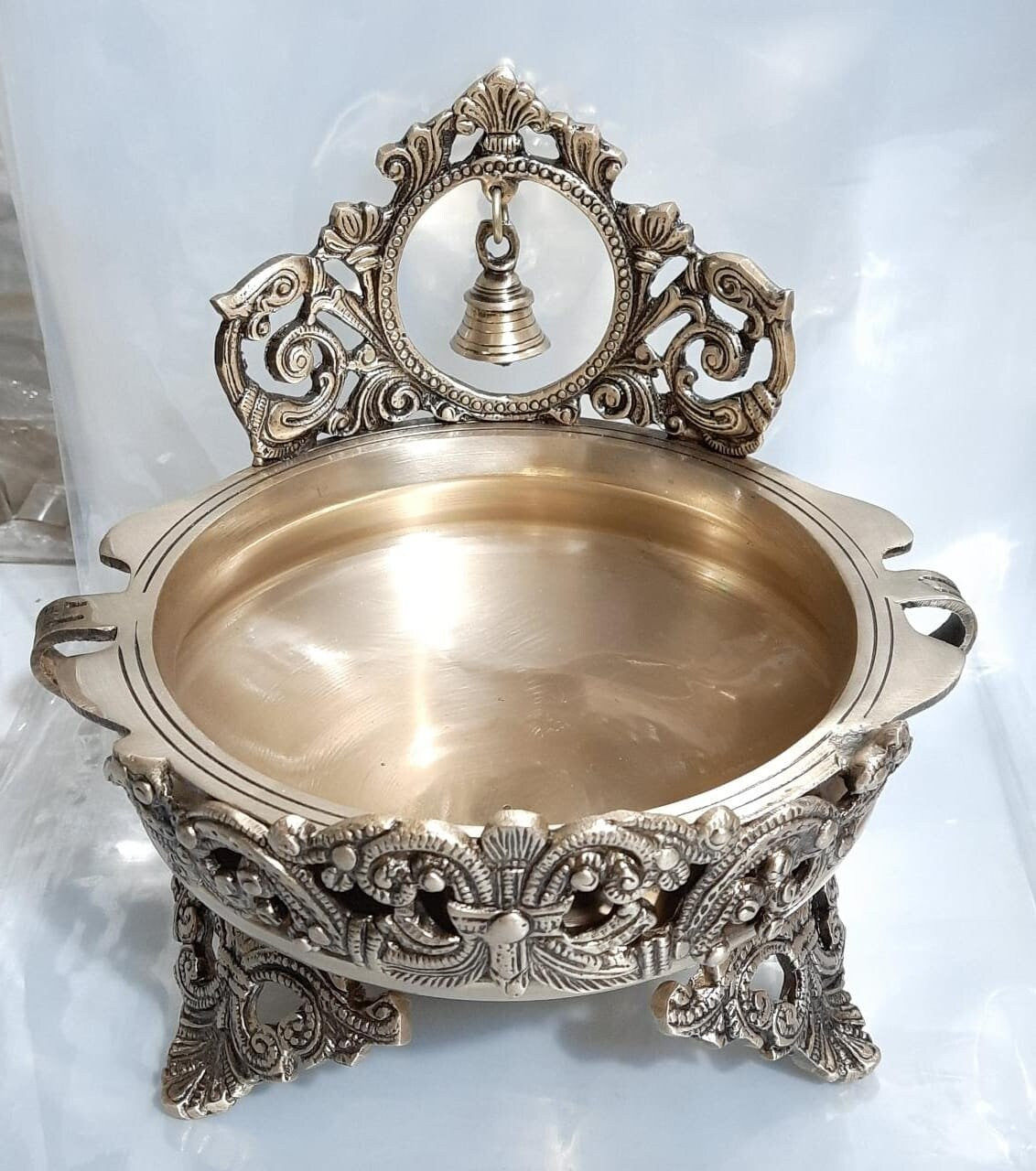 Brass Designer Ethnic Carved Decorative Urli Bowl in Antique finish with Bell for Floating Flowers and Tea Light Candles