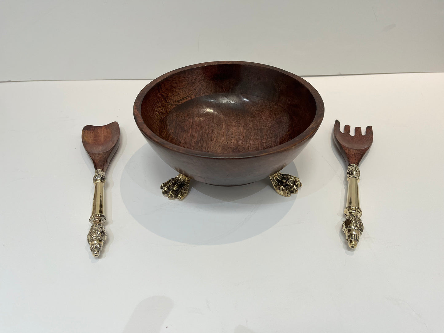 Beautiful wooden salad bowl with tongs