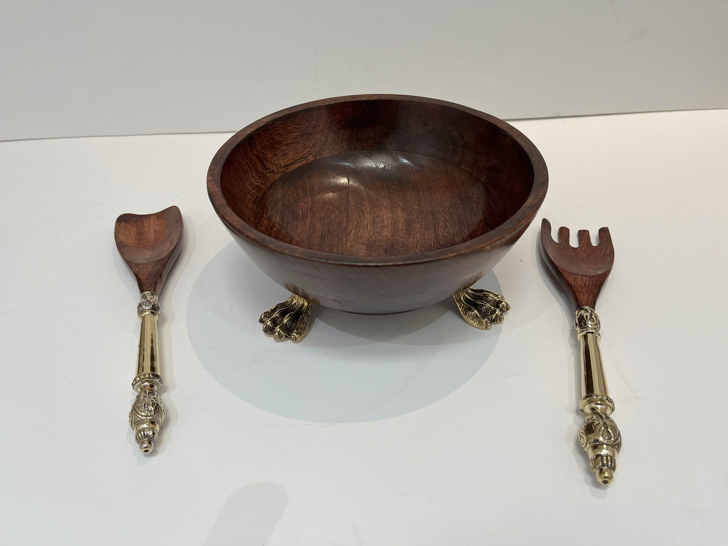 Beautiful wooden salad bowl with tongs