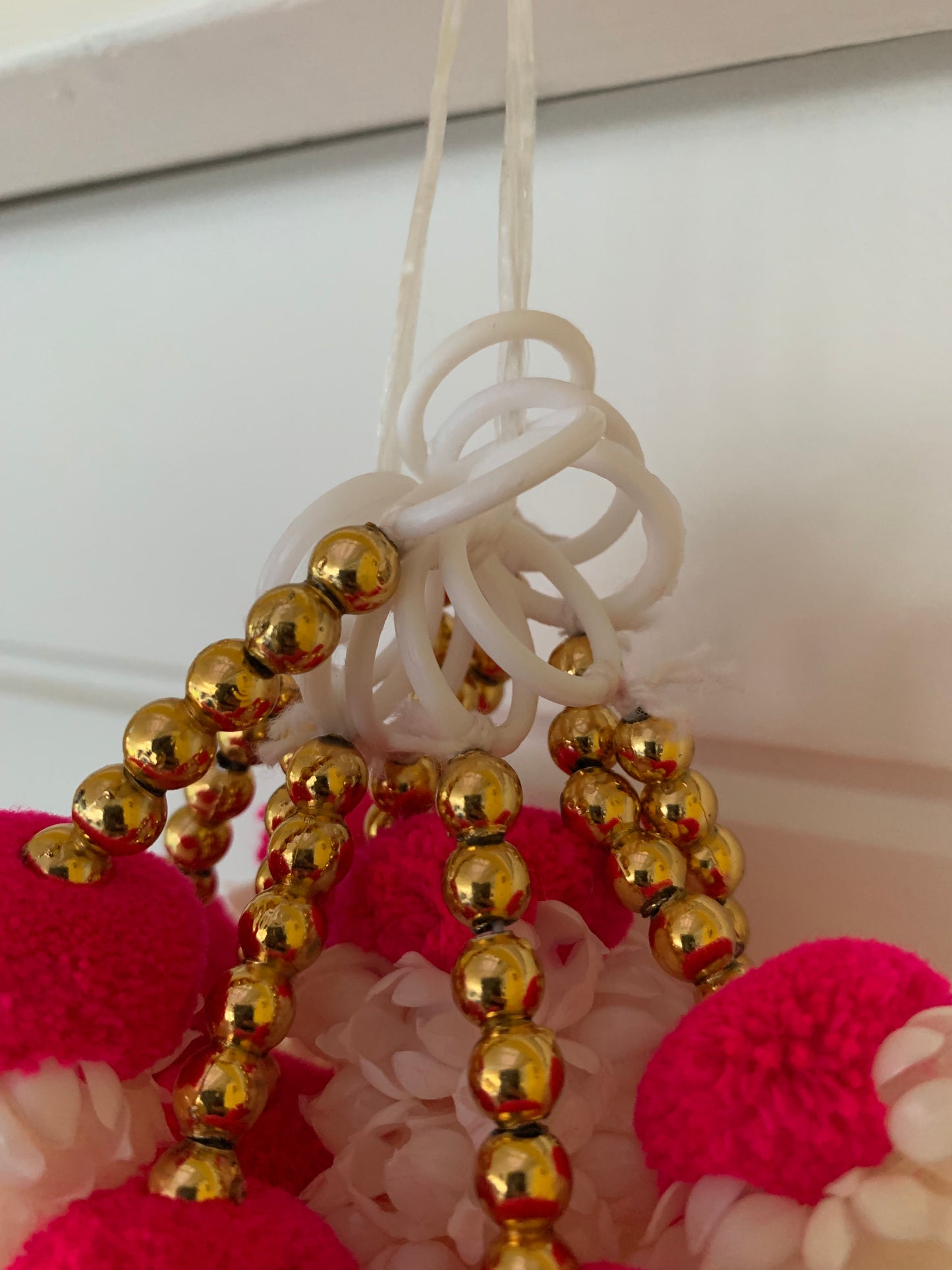 Handmade Red and white floral Hanging Decoration for Weddings and Festive Occasions.