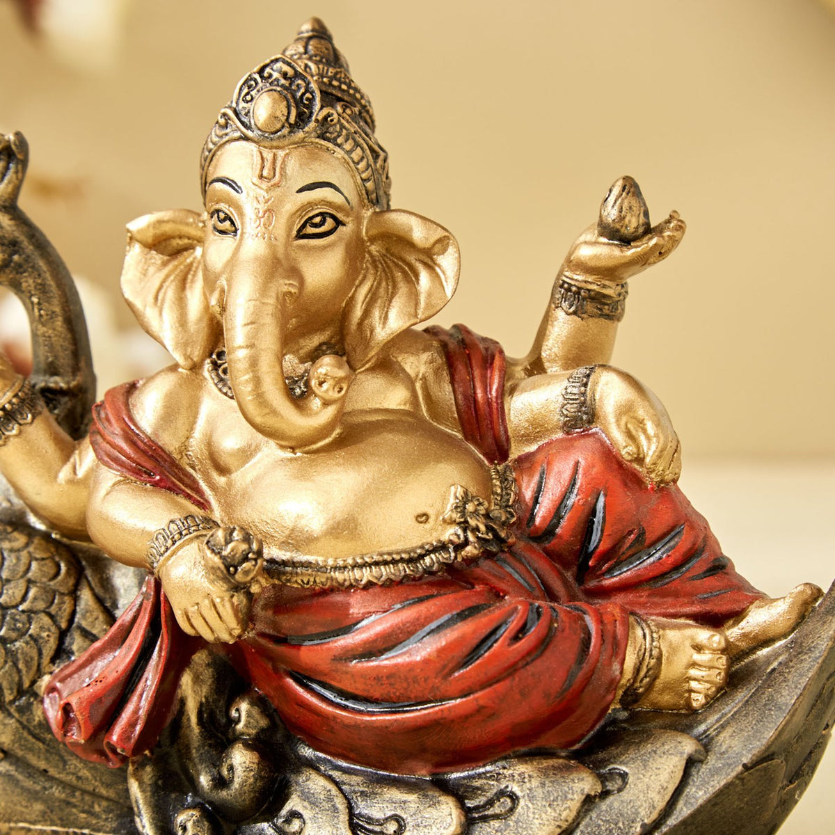 Handcrafted Ganesha resting on Peacock