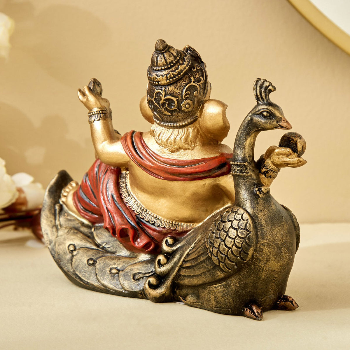 Handcrafted Ganesha resting on Peacock