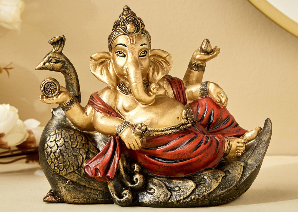 Handcrafted Ganesha resting on Peacock