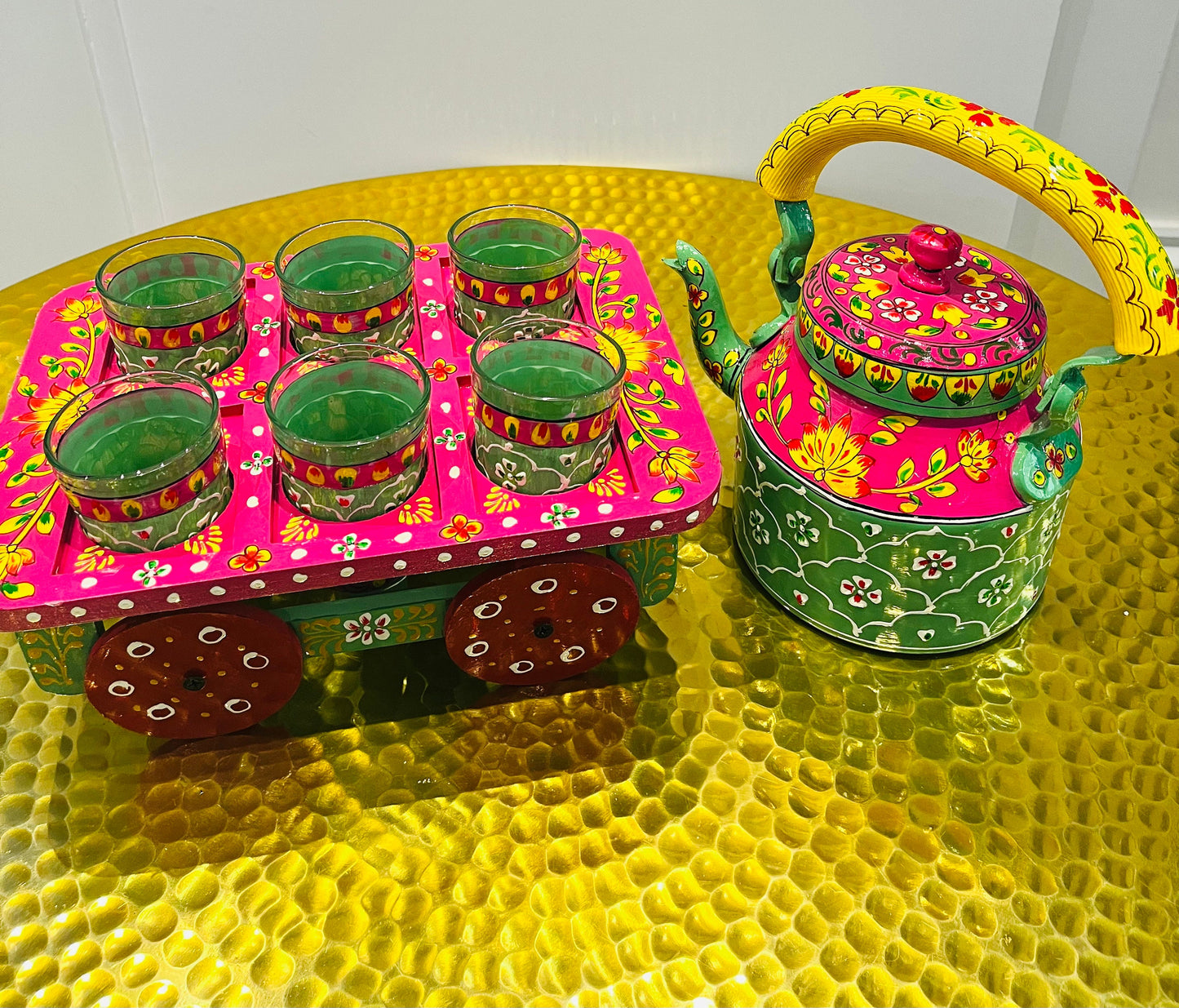 Handpainted indian tea kettle with 6 glasses and a kart.