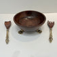 Beautiful wooden salad bowl with tongs
