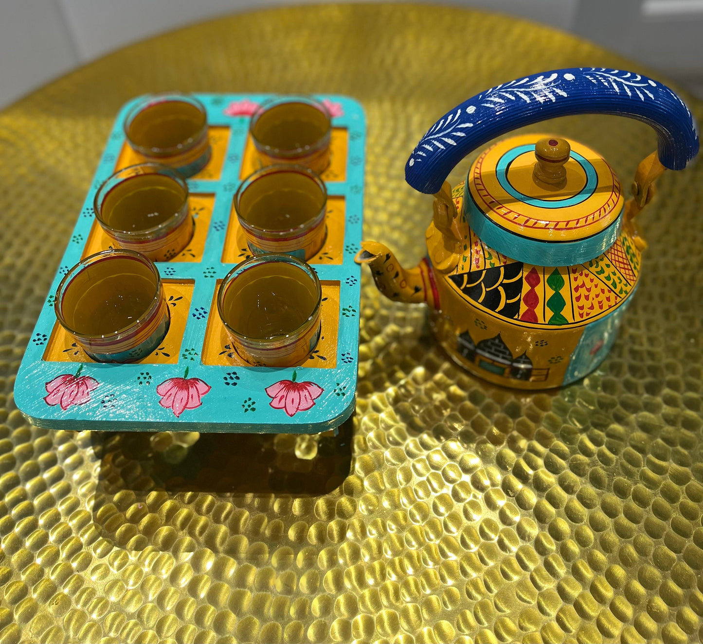 Handpainted indian tea kettle with 6 glasses and a kart.