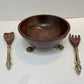 Beautiful wooden salad bowl with tongs